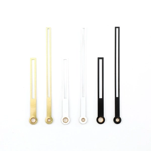 Three sets of minimalist metal clock hands in gold, silver, and black finish on white background