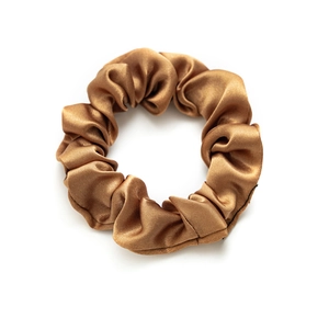 Elastic satin bronze scrunchie hair tie with metallic luster on white background