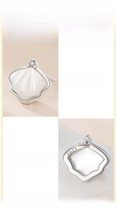 Detailed macro view of S925 sterling silver shell stud earrings with white mother-of-pearl