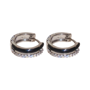 Silver geometric hoop earrings with black enamel inlay and clear zircon stones on white