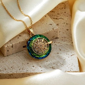 Elegant gold necklace with round gradient crystal pendant and sunburst zircon design