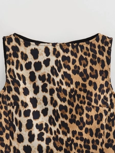 Detailed view of leopard print fabric on a sleeveless A-line dress with a boat neckline