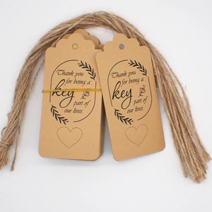 Brown kraft paper thank you tags set with twine and decorative heart pattern text