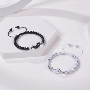 Detail of Yin Yang couples bracelets with matte black and white marble stone beads