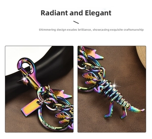 Macro detail of dinosaur keychain featuring rainbow plating and elegant metal links