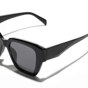 Modern black thick frame rectangular sunglasses with high-gloss finish and sleek temples