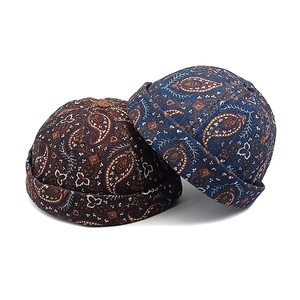 Vintage paisley miki hats in coffee and navy featuring rolled edges and cotton fabric
