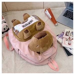 Pink nylon backpack featuring cute plush capybara details and transparent front pocket