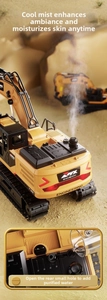 Detail of toy excavator with realistic water spray mist feature and yellow hydraulic arm