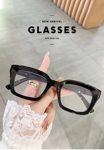 Detail shot of black square anti-blue light reading glasses with spring hinges for comfort