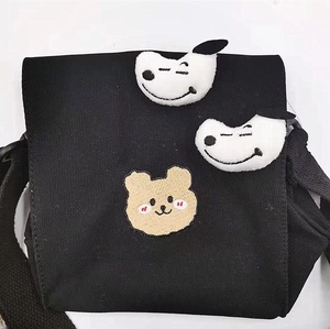 Black canvas messenger bag with cute embroidered bear and 3D plush puppy character
