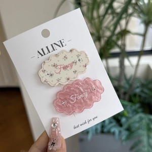 Floral cloud hair clips with marble texture and Fancy text on brand display card