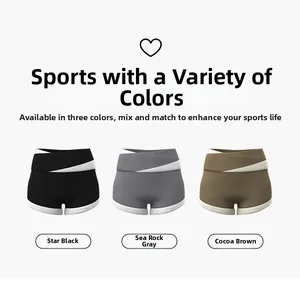 Detailed view of high-waisted yoga shorts in black, grey, and cocoa with contrast piping