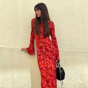 Close-up of red long-sleeve floral maxi dress featuring elegant trumpet cuffs and prints