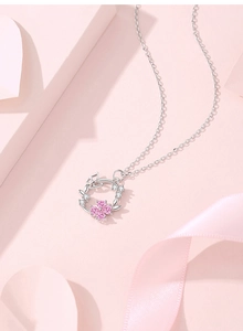 Detail of S925 silver wreath necklace featuring pink gemstones and white zircons