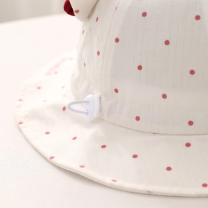 Polka dot baby sun hat for girls featuring adjustable drawstring and plastic toggle