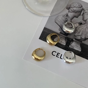 Polished teardrop stud earrings in gold and silver finish for a minimalist fashion style