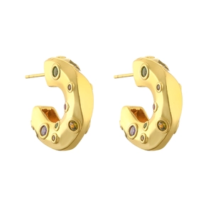 Close-up of golden C-shaped hoop earrings with colorful inlaid micro zircon gemstones