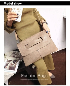 Brown PU leather crossbody bag with vintage grain texture and stylish hand strap detail