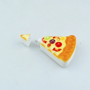 Detail of creative pizza shaped ballpoint pen with removable cap showing realistic toppings