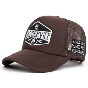 Close-up of GAS SERVICE embroidery and mesh detail on a vintage brown trucker hat
