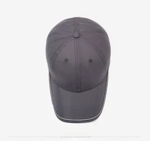 Top view of dark grey quick-dry baseball cap showing breathable vents and embroidery