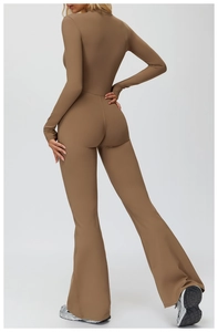 Back view of thermal fleece yoga jumpsuit featuring wide flare legs and slim fit design
