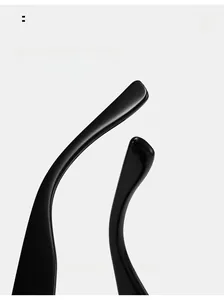 Detail view of glossy black curved temple tips on retro rectangle sunglasses for comfort