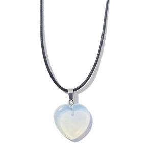 Close-up of 20mm heart-shaped opal stone pendant on black braided leather cord