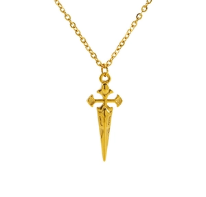 Macro detail of golden cross and dagger pendant made of polished stainless steel
