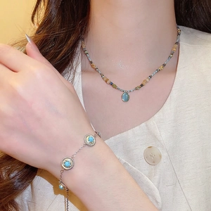 Bohemian beaded necklace and bracelet set with oval blue stone pendant for women