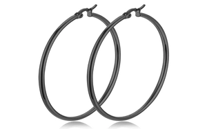 Detail view of large black hoop earrings in minimalist stainless steel with secure clasp