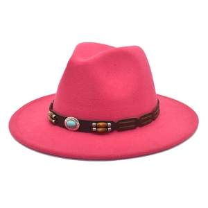 Detail of wool fedora hat featuring brown leather band with turquoise stone and wooden beads