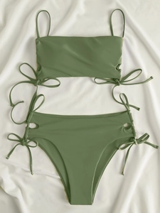 Detail of olive green high-waisted bikini with adjustable side drawstring ties