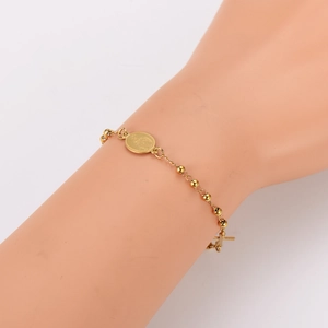French style gold beaded bracelet featuring Virgin Mary medal and cross pendants
