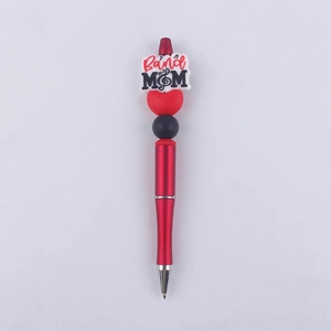 Detail of red beaded ballpoint pen featuring Best MOM silicone tag and heart decoration