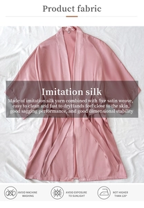 Detail of pink imitation silk loungewear robe showing high-gloss fabric texture and belt