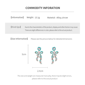 Detailed spec sheet showing zircon bow earrings size 5cm x 2.4cm and 13.1g weight