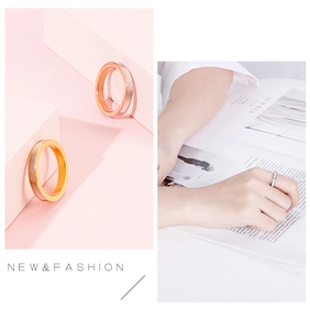 Detail of 3mm titanium steel rings in gold and rose gold finish with white shell inlay