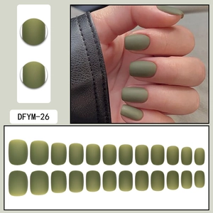 Detail view of 24 pieces olive green matte press-on nails with flat lay and worn effect