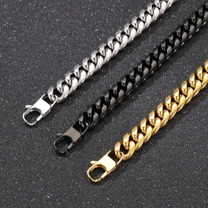 Close-up of stainless steel curb chains in silver black and gold with lobster clasps