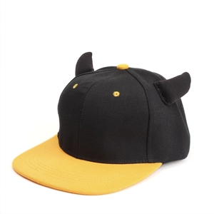 Detail view of the black and yellow color-block cap featuring creative 3D devil horns