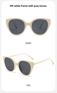 Detail view of cream cat-eye sunglasses with gold metal temples and gray lenses
