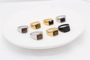 Retro square gemstone rings in gold, silver, and black finish on a white display tray