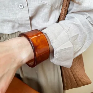 Minimalist wide amber resin cuff bracelet with natural cloud texture for women