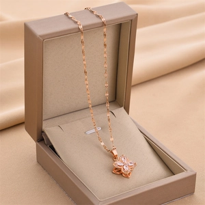 Elegant rose gold spinning four-leaf clover necklace with sparkling marquise cut zircon