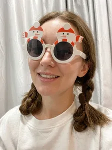 Detail view of festive snowman Christmas glasses for holiday party dress up and props