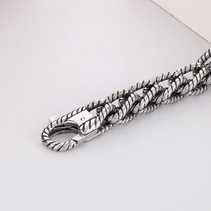 Macro shot of punk braided twist link chain with vintage steel lobster clasp