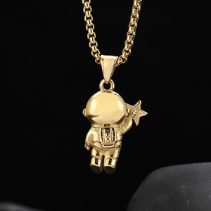 Gold astronaut pendant necklace in stainless steel with box chain and celestial theme