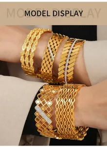 Close-up of luxury gold-plated hollow bangles with geometric patterns and zircon stones
